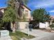 Charming two-story home featuring a well-maintained lawn, mature trees, and a two-car garage at 11147 Verismo St, Las Vegas, NV 89141