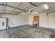 Spacious garage with overhead lighting, storage, and automatic door at 11147 Verismo St, Las Vegas, NV 89141