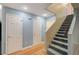 Bright hallway with neutral walls, a staircase, and multiple doorways, creating easy access to other areas at 11147 Verismo St, Las Vegas, NV 89141