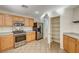 The kitchen has light wood cabinets, modern appliances, and a convenient pantry for easy storage and organization at 11147 Verismo St, Las Vegas, NV 89141