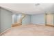 Open floor plan with a staircase, neutral paint, and a mix of carpet and wood flooring at 11147 Verismo St, Las Vegas, NV 89141