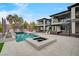 Modern home boasts a stunning backyard with a pool, spa, and an outdoor basketball court at 1704 Tangiers Dr, Henderson, NV 89012