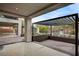 Expansive backyard patio with a covered seating area, perfect for outdoor entertaining by the pool at 1704 Tangiers Dr, Henderson, NV 89012