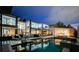 Expansive backyard featuring a large pool, hot tub, outdoor kitchen, and covered patio for outdoor enjoyment at 1704 Tangiers Dr, Henderson, NV 89012