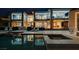 Stunning backyard with a modern pool, spa, lounge area, and outdoor spiral staircase, perfect for relaxation at 1704 Tangiers Dr, Henderson, NV 89012