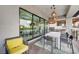 The covered balcony offers an outdoor kitchen and dining area with large windows at 1704 Tangiers Dr, Henderson, NV 89012