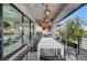 This balcony showcases a built-in outdoor kitchen and dining area with elegant lighting at 1704 Tangiers Dr, Henderson, NV 89012