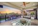 Stylish covered balcony with seating, fan, and sunset views at 1704 Tangiers Dr, Henderson, NV 89012