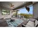 This large balcony features outdoor seating, a ceiling fan, and stunning views at 1704 Tangiers Dr, Henderson, NV 89012