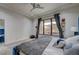 Cozy bedroom with carpet, blue bed, and large window at 1704 Tangiers Dr, Henderson, NV 89012