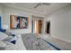 Bedroom featuring a large bed with a graphic quilt and contemporary art at 1704 Tangiers Dr, Henderson, NV 89012