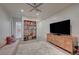 Bright bedroom featuring a large TV and a bookshelf at 1704 Tangiers Dr, Henderson, NV 89012
