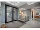 Contemporary foyer featuring unique lighting fixtures, sleek railings, and stylish decor at 1704 Tangiers Dr, Henderson, NV 89012