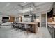 Gourmet kitchen featuring a large island with bar seating, stainless steel appliances, and a seamless open floor plan at 1704 Tangiers Dr, Henderson, NV 89012