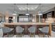 The gourmet kitchen boasts stainless steel appliances, a large island with bar seating, and pendant lighting at 1704 Tangiers Dr, Henderson, NV 89012