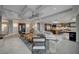 Open-concept living room features a fireplace, access to the kitchen, and coffered ceilings at 1704 Tangiers Dr, Henderson, NV 89012