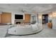 The cozy living room features a fireplace, a large television, and comfortable seating at 1704 Tangiers Dr, Henderson, NV 89012