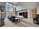Spacious living room with high ceilings, comfortable seating, and a view of the backyard at 1704 Tangiers Dr, Henderson, NV 89012