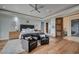 Cozy bedroom featuring hardwood floors, a king bed, and a sitting area at 1704 Tangiers Dr, Henderson, NV 89012