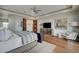 Elegant bedroom with a king-size bed, hardwood floors, and modern decor at 1704 Tangiers Dr, Henderson, NV 89012