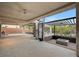 An expansive patio with seating areas, a modern fire pit, and a spiral staircase at 1704 Tangiers Dr, Henderson, NV 89012