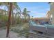 Backyard area with a deck featuring outdoor seating and a grassy area at 193 Calabria Peak Ct, Henderson, NV 89012