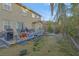 Spacious backyard features partial wood deck, grill, and partially xeriscaped areas at 193 Calabria Peak Ct, Henderson, NV 89012
