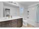 Clean bathroom features a sink vanity with white countertop and shower-tub combo at 193 Calabria Peak Ct, Henderson, NV 89012