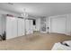 Spacious bedroom featuring white walls, carpeted floor, and storage with open shelving at 193 Calabria Peak Ct, Henderson, NV 89012