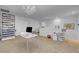 Bright bedroom featuring carpeted floor, storage with open shelving, and a desk at 193 Calabria Peak Ct, Henderson, NV 89012