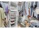 Well-organized walk-in closet with shelving, hanging rods, and visible clothing at 193 Calabria Peak Ct, Henderson, NV 89012