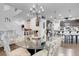 Open concept dining area with a chandelier, table, and a view of the kitchen at 193 Calabria Peak Ct, Henderson, NV 89012