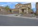 Charming two-story home with a well-maintained yard, front porch, and two car garage at 193 Calabria Peak Ct, Henderson, NV 89012
