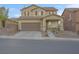 Charming two-story home with a well-maintained yard, front porch, and two car garage at 193 Calabria Peak Ct, Henderson, NV 89012