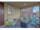 Cozy front porch with chairs, small table, and a view of the neighborhood at 193 Calabria Peak Ct, Henderson, NV 89012