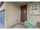 Inviting front porch area with a welcome mat and view of the garage entrance at 193 Calabria Peak Ct, Henderson, NV 89012