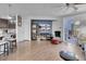 Bright and airy living room with hardwood floors and a stylish entertainment center at 193 Calabria Peak Ct, Henderson, NV 89012