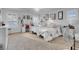 Spacious main bedroom features carpeted floor, a ceiling fan, and large windows at 193 Calabria Peak Ct, Henderson, NV 89012
