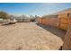 Large, dirt backyard featuring a secure fence and potential for customization to create an outdoor living space at 203 N 13Th St, Las Vegas, NV 89101