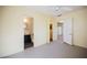 Bedroom with a ceiling fan, and access to both a full bath and the kitchen at 203 N 13Th St, Las Vegas, NV 89101