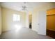 Bedroom with a ceiling fan, and direct access to a walk-in closet and bathroom at 203 N 13Th St, Las Vegas, NV 89101