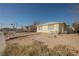 Cozy single-story home featuring a flat roof, neutral paint, and a minimalist front yard at 203 N 13Th St, Las Vegas, NV 89101