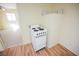 Small kitchen area features light walls, wood-look floors, and white oven at 203 N 13Th St, Las Vegas, NV 89101