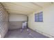 Exterior laundry room featuring a washing machine, window, and concrete floors at 203 N 13Th St, Las Vegas, NV 89101