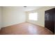 A bright living room featuring light walls, wood-look floors and natural light from the window at 203 N 13Th St, Las Vegas, NV 89101