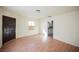 A bright living room featuring light walls, wood-look floors and a kitchen view at 203 N 13Th St, Las Vegas, NV 89101