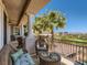 Inviting balcony area with seating offering panoramic views of the lush green golf course at 2038 Cherry Creek Cir, Las Vegas, NV 89135