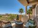 Relaxing covered balcony with comfortable wicker furniture and picturesque golf course views at 2038 Cherry Creek Cir, Las Vegas, NV 89135