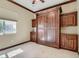 A cozy bedroom features a built-in Murphy bed and custom cabinetry offering space-saving convenience and functionality at 2038 Cherry Creek Cir, Las Vegas, NV 89135