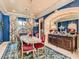 An elegant dining room boasting a beautiful chandelier, dark blue walls, and luxurious decor at 2038 Cherry Creek Cir, Las Vegas, NV 89135